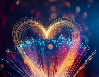 Colorful artistic display featuring vibrant light patterns shaped like a heart, expressing love and