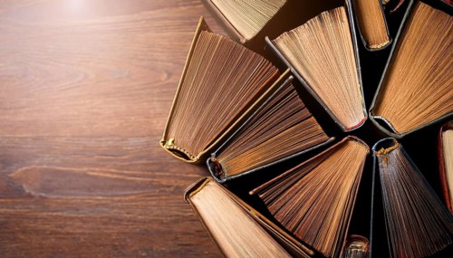 Old books arranged highlighting their historical significance. Neatly arranged representing a