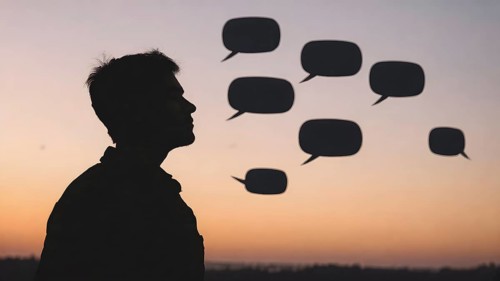 Thinking man silhouette with speech bubble concept, symbolizing dialogue, reflection, creative