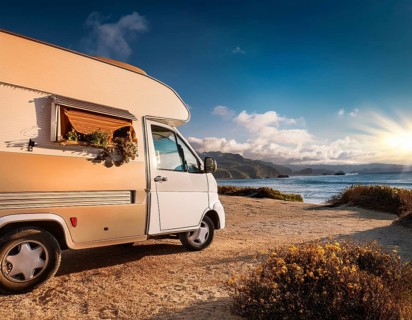 Holiday van with luggage on beach, space for text. Summer vacation trip, AI generated