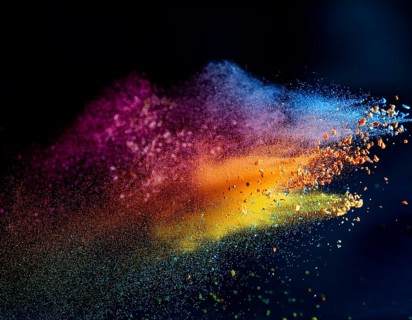 A colorful explosion powder on black background.. Multicolored powder explosion, AI generated