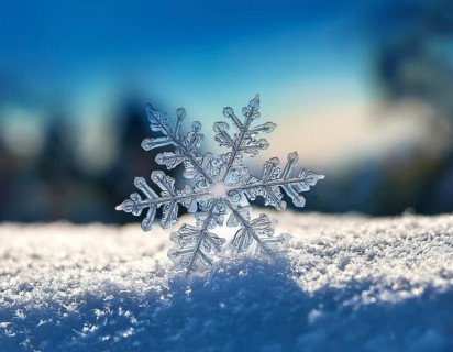 Macro photo of real snow crystal on glass surface. This is small snowflake with unusual pattern, AI