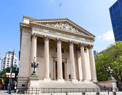 Bank building facade with classical columns, symbolizing finance, economic stability, investment
