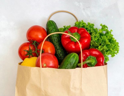 Fresh vegetables and fruits in reusable eco bag, symbolizing sustainability, healthy eating, zero