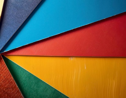 Multi color background bursting with vivid tones, artistic expression, and modern abstract design