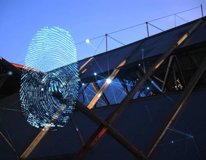 Glowing digital fingerprint wall art symbolizing cybersecurity, identity protection, and futuristic