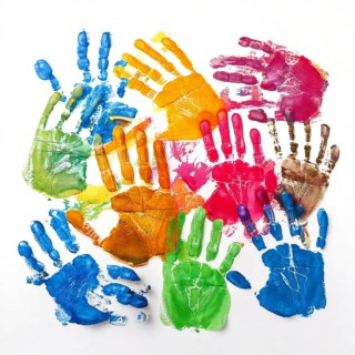 Vibrant multicolored handprints on white background, symbolizing creativity, playful expression,