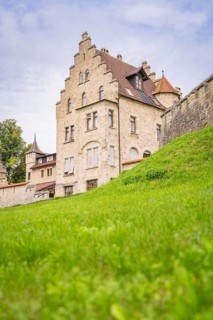 Impressive historic building with gabled roof and green meadow, Lichtenstein Castle, Lichtenstein,