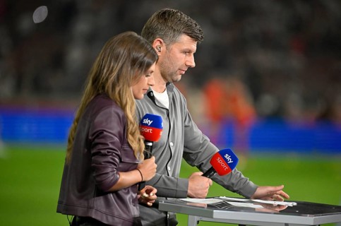 SKY presenter Mara Mones in an interview Microphone Logo with TV expert Thomas Hitzlsperger German