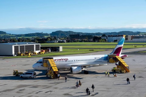 Passengers boarding an Airbus A320-214 of the airline Eurowings at Salzburg Airport, Austria