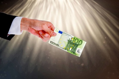 Symbolic image, hand reaches out 100-euro note, purchasing power, stable currency, currency war,