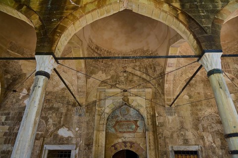 Interior with antique arcades and stone decorations in a historic building, Recep Pasha Mosque, Old