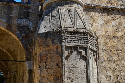 Historic masonry with detailed relief elements and play of the sun on the surface, Recep Pasha
