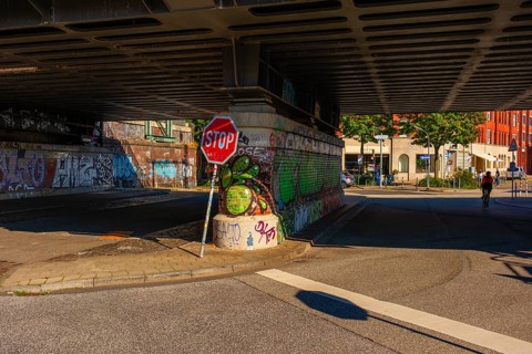 View of parts of a road leading under the Oberhafen Bridge and of the abutment painted with