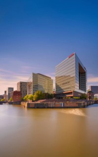 Photograph of light reflections on the water surface from a long exposure and the mirror building