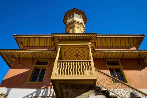 Ottoman building with wood-decorated tower and balconies that stand out majestically against the