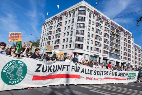 Demonstrators with front banner Future for all instead of gas for the rich on Friedrichstraße at