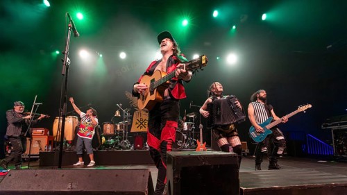 Eugene Hütz, centre, singer and guitarist, Gogol Bordello, folk-punk band, USA, live on Fall 2025