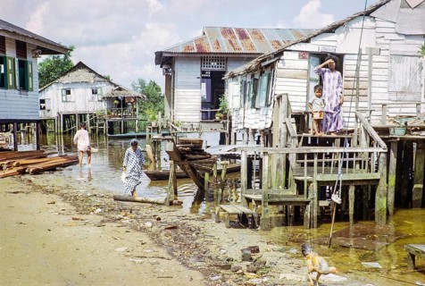 Houses on stilts above sea water in coastal village of Kampong Lorong Fatimah in Singapore,