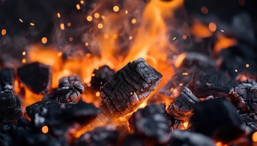 Abstract Defocused Sparks And Hot Flames In Charcoal For Barbecue: Enhancing The Grilling