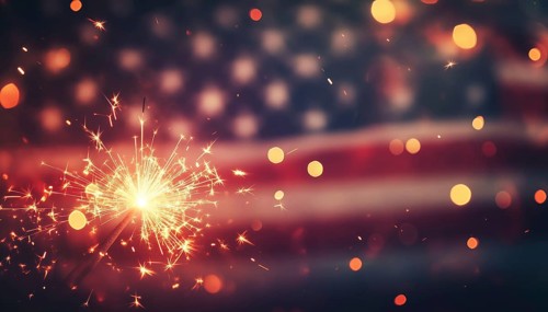 Abstract Defocused Lights On An American Flag With Sparkler For Independence Day And Memorial Day
