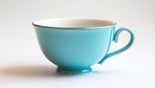 Stunning Display Of Blue Teacup On White Background - A Beautiful Showcase Of A Blue Teacup Against