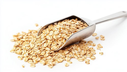 Premium Oat Groats And Rolled Oats Displayed On Metal Scoop Against A White Background - Featuring