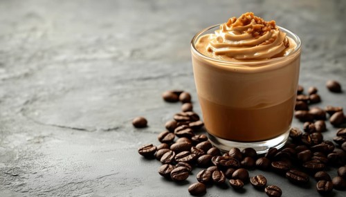 Side View Close-Up Of Dalgona Coffee And Coffee Beans On A Gray Background: A Detailed Look At The