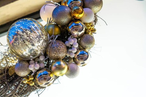 Christmas balls and lights hanging at night in bayonne, france, creating a festive atmosphere