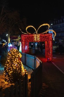 Christmas lights illuminating a giant gift shaped arch during the festive season in bayonne,