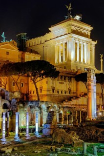 View at night over the Caesar Forum of Julius Caesar, illuminated in colour from the front, with