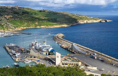 View of jetty for ferries from to Valletta island Malta and moored ferry car ferry, on the right