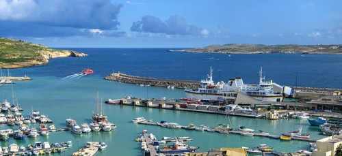 View of harbour basin of Gozo Mgarr Harbour with small boats yachts yachts, in the middle of the