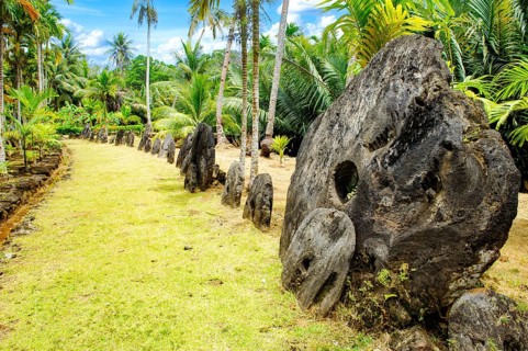 Oversized large giant stone coins real currency in stone money bank stone money bank in jungle of