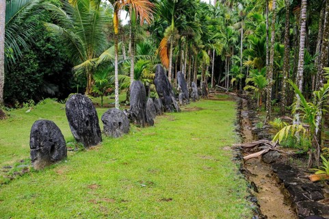 Oversized large giant stone coins real currency in stone money bank stone money bank in jungle of