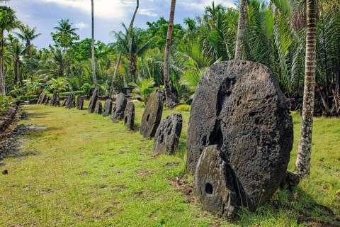 Oversized large giant stone coins real stone money in stone money bank stone money bank in jungle