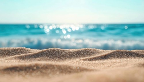 Abstract And Defocused Ocean Views Mingle Harmoniously With Beach Sand In This Serene And Calming