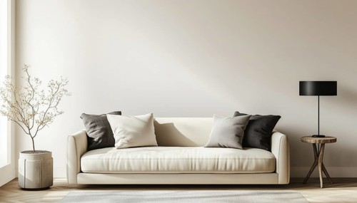 Sophisticated Living Room Interior Featuring Table Lamp Above Beige Sofa And Side Table On Empty