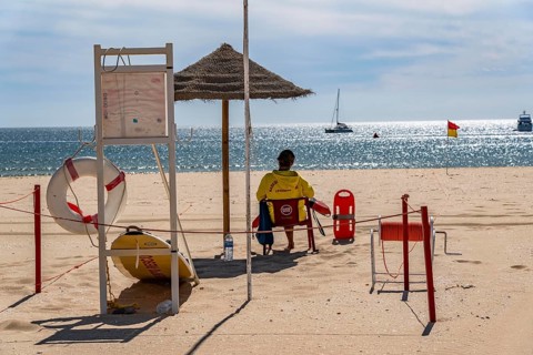 The Praia de São Roque beach, east of Lagos town centre, quite empty, lifeguards on duty,
