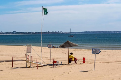 The Praia de São Roque beach, east of Lagos town centre, quite empty, lifeguards on duty,
