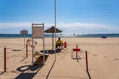 The Praia de São Roque beach, east of Lagos town centre, quite empty, lifeguards on duty,
