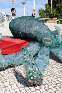 Figure of an octopus, filled with PET bottles, plastic products, reminder not to produce so much