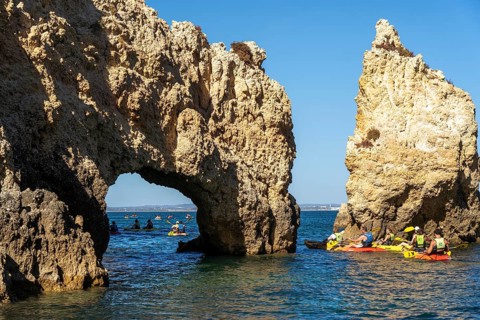 Tour with sea kayaks to the Ponta da Piedade rocky coast, rugged coastal landscape, right next to