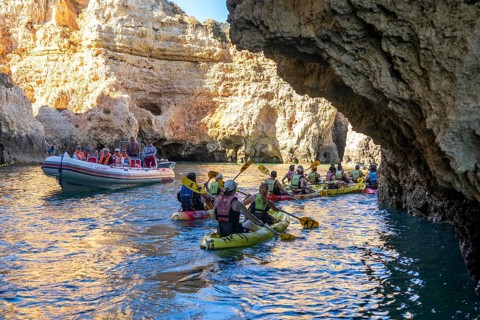 Tour with sea kayaks to the Ponta da Piedade rocky coast, rugged coastal landscape, right next to