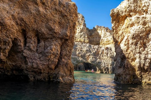 Tour with sea kayaks to the Ponta da Piedade rocky coast, rugged coastal landscape, right next to