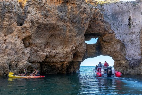 Tour with a small motorboat to the Ponta da Piedade rocky coast, rugged coastal landscape, right