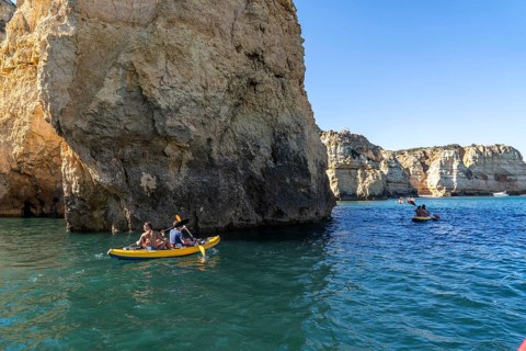 Tour with sea kayaks to the Ponta da Piedade rocky coast, rugged coastal landscape, right next to