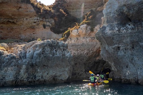 Tour with sea kayaks to the Ponta da Piedade rocky coast, rugged coastal landscape, right next to