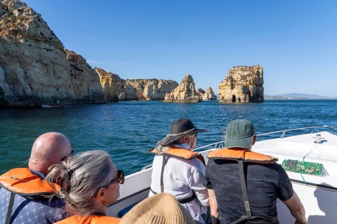 Tour with a small motorboat to the Ponta da Piedade rocky coast, rugged coastal landscape, right