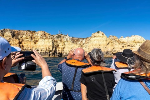 Tour with a small motorboat to the Ponta da Piedade rocky coast, rugged coastal landscape, right